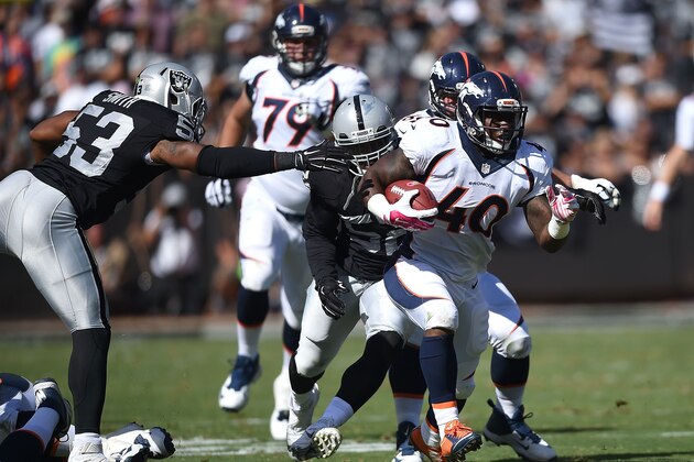OAKLAND, CA - OCTOBER 11: Juwan Thompson #40 of the Denver Broncos leads the Oakland Raiders defense at O.co Coliseum on October 11, 2015 in Oakland, California. (Photo by Thearon W. Henderson/Getty Images)