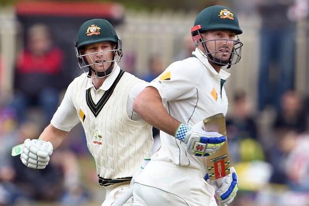 Australian batsmen Adam Voges (L) and Shaun Marsh (R) take more runs from the West Indies bowling on the second day of the first cricket Test match in Hobart on December 11, 2015.   AFP PHOTO / William WEST   --IMAGE RESTRICTED TO EDITORIAL USE - NO COMMERCIAL USE-- / AFP / WILLIAM WEST        (Photo credit should read WILLIAM WEST/AFP/Getty Images)