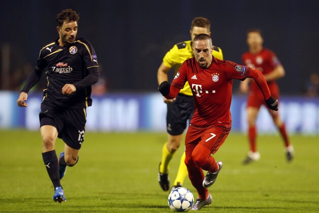 Bayern's Franck Ribery, right and Zagreb's Goncalo Santos run for the ball during the Champions League Group F soccer match between Dinamo Zagreb and Bayern Munich in Zagreb, Croatia, Wednesday, Dec. 9, 2015. (AP Photo/Darko Bandic)