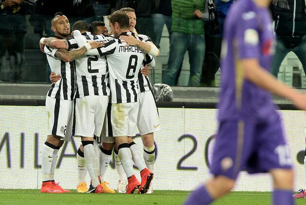 Juventus' players celebrates after Carlos Tevez scored during a Serie A soccer match between Juventus and Fiorentina  at the Juventus stadium, in Turin, Italy, Wednesday, April 29, 2015. (AP Photo/Massimo Pinca)