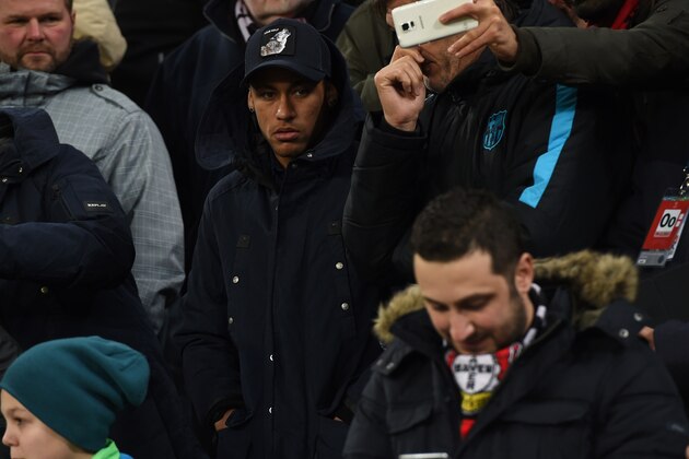Barcelona's Brazilian forward Neymar (C) looks on  during the Group E, second-leg UEFA Champions League football match Bayer 04 Leverkusen vs FC Barcelona in Leverkusen, western Germany on December 9, 2015. AFP PHOTO / PATRIK STOLLARZ / AFP / PATRIK STOLLARZ        (Photo credit should read PATRIK STOLLARZ/AFP/Getty Images)
