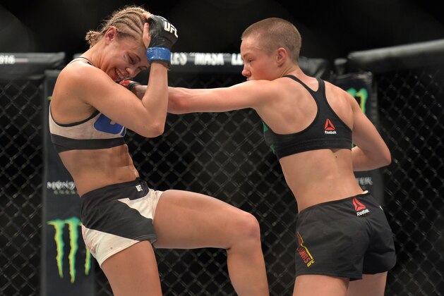 LAS VEGAS, NEVADA - DECEMBER 10:  (R-L) Rose Namajunas punches Paige VanZant in their women's strawweight bout during the UFC Fight Night event at The Chelsea at the Cosmopolitan of Las Vegas on December 10, 2015 in Las Vegas, Nevada.  (Photo by Brandon Magnus/Zuffa LLC/Zuffa LLC via Getty Images)