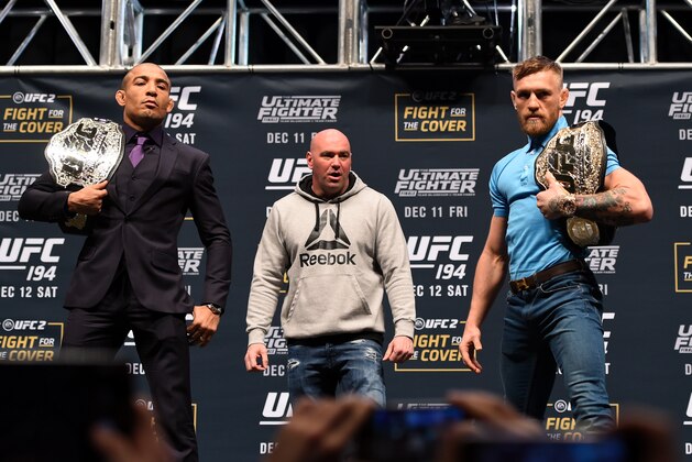 LAS VEGAS, NV - DECEMBER 09:  (L-R) Opponents Jose Aldo of Brazil and Conor McGregor of Ireland pose for photos during the UFC Press Conference inside MGM Grand Garden Arena on December 9, 2015 in Las Vegas, Nevada.  (Photo by Josh Hedges/Zuffa LLC/Zuffa LLC via Getty Images)