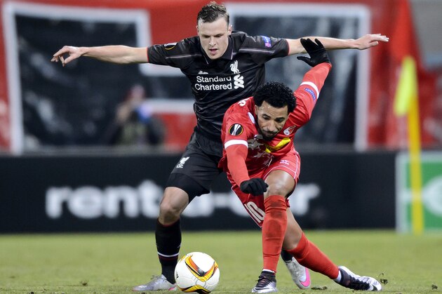 Liverpool's Australian defender Brad Smith (L) and Sion's Portugese midfielder Carlitos vie for the ball during the UEFA Europa League group B football match between FC Sion and FC Liverpool at the Tourbillon stadium in Sion on December 10, 2015.  / AFP / FABRICE COFFRINI        (Photo credit should read FABRICE COFFRINI/AFP/Getty Images)