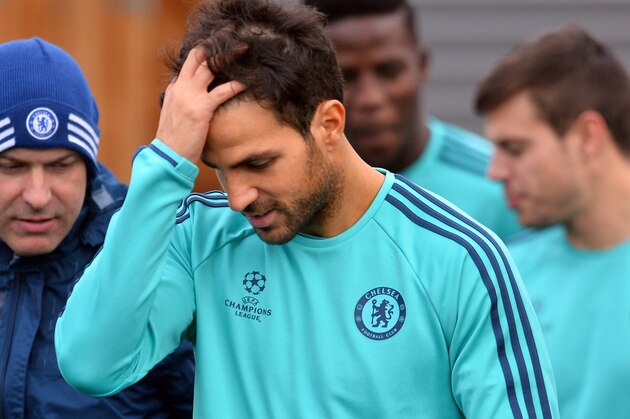 Chelsea's Spanish midfielder Cesc Fabregas (C) attends a training session on the eve of a UEFA Champions League, group G football match against Porto at Chelsea's training ground in Cobham, south west London on December 8, 2015. 
AFP PHOTO / GLYN KIRK / AFP / GLYN KIRK        (Photo credit should read GLYN KIRK/AFP/Getty Images)