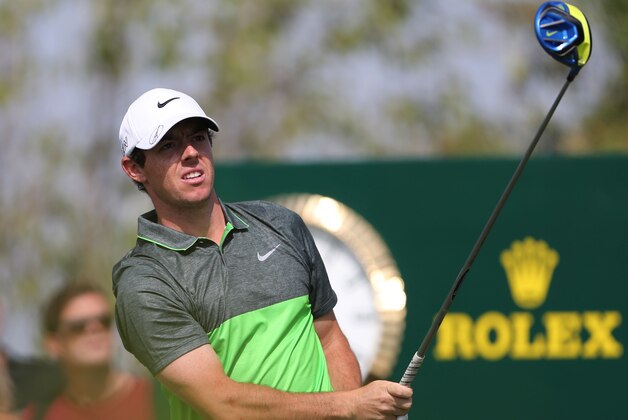 Rory McIlroy of Northern Ireland follows his ball on the 2nd hole during the third round of DP World Tour Championship golf tournament in Dubai, United Arab Emirates, Saturday, Nov. 21, 2015. (AP Photo/Kamran Jebreili)