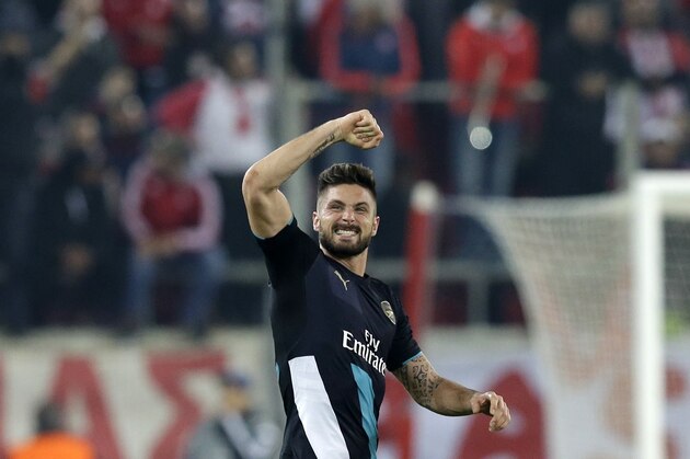 Arsenal's Olivier Giroud celebrates after scoring the third goal of his team during the Champions League Group F soccer match between Olympiakos and Arsenal at Georgios Karaiskakis stadium in Piraeus port, near Athens, Wednesday, Dec. 9, 2015. (AP Photo/Thanassis Stavrakis)