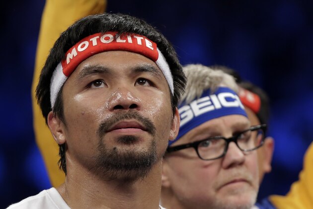 Manny Pacquiao, from the Philippines, gets ready before the welterweight title fight against  Floyd Mayweather Jr., on Saturday, May 2, 2015 in Las Vegas.  (AP Photo/Isaac Brekken)