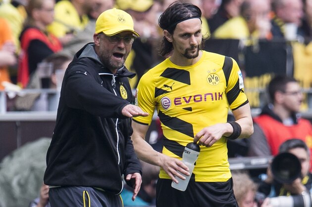 coach Jurgen Klopp of Borussia Dortmund give instructions to Neven Subotic of Borussia Dortmund during the Bundesliga match between Borussia Dortmund and Werder Bremen on May 23, 2015 at the Signal Iduna Park in Dortmund, Germany.(Photo by VI Images via Getty Images)