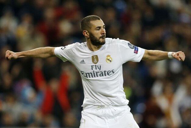 Real Madrid’s Karim Benzema, celebrates scoring his side's 8th goal during a Champions League group A soccer match between Real Madrid and Malmo at the Santiago Bernabeu stadium in Madrid, Tuesday, Dec. 8, 2015. (AP Photo/Francisco Seco)