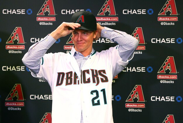 Dec 11, 2015; Phoenix, AZ, USA; Arizona Diamondbacks pitcher Zack Greinke puts on a baseball hat during a press conference at Chase Field . Mandatory Credit: Mark J. Rebilas-USA TODAY Sports