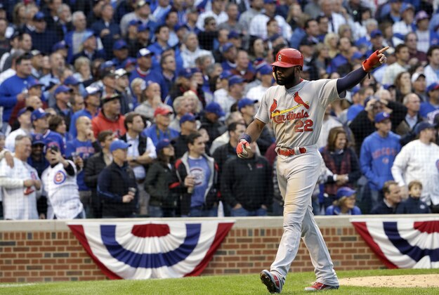 St. Louis Cardinals' Jason Heyward (22) reacts as he scores a run on an RBI double by Tony Cruz during the sixth inning of Game 4 in baseball's National League Division Series against the Chicago Cubs, Tuesday, Oct. 13, 2015, in Chicago. (AP Photo/Nam Y. Huh)