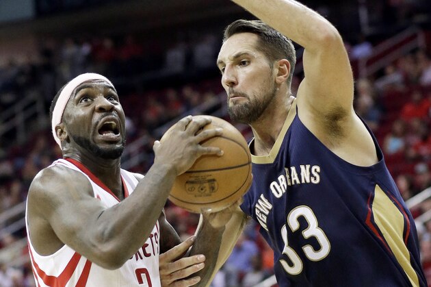 Houston Rockets' Ty Lawson (3) shoots under pressure from New Orleans Pelicans' Ryan Anderson (33) in the second half of a preseason NBA basketball game Monday, Oct. 19, 2015, in Houston. (AP Photo/Pat Sullivan)