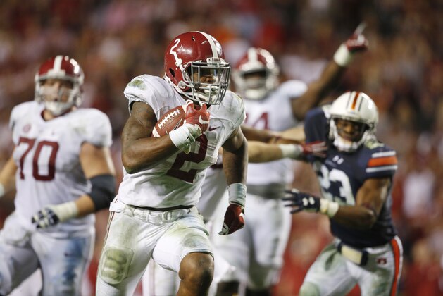Alabama running back Derrick Henry (2) scores a touchdown in the second half of an NCAA college football game against Auburn, Saturday, Nov. 28, 2015, in Auburn, Ala. Alabama won 29-13. (AP Photo/Gerald Herbert)