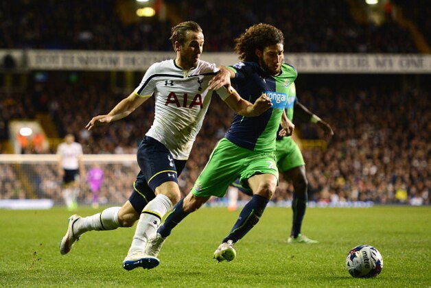 LONDON, ENGLAND - DECEMBER 17: Harry Kane of Tottenham Hotspur takes on Fabricio Coloccini of Newcastle United during the Capital One Cup Quarter-Final match between Tottenham Hotspur and Newcastle United at White Hart Lane on December 17, 2014 in London, England.  (Photo by Jamie McDonald/Getty Images)