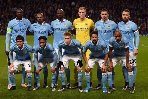 Manchester City's starting XI pose for the official photograph (top row L-R) Ivorian midfielder Yaya Toure, Brazilian midfielder Fernandinho, French defender Eliaquim Mangala, English goalkeeper Joe Hart, Serbian defender Aleksandar Kolarov and Argentinian defender Nicolas Otamendi and (bottom row L-R) Spanish midfielder David Silva, English forward Raheem Sterling, Belgian midfielder Kevin De Bruyne, French defender Gael Clichy and English midfielder Fabian Delph before the UEFA Champions League Group D football match between Manchester City and Borussia Moenchengladbach at the Etihad Stadium in Manchester, northwest England, on December 8, 2015. AFP PHOTO/PAUL ELLIS / AFP / PAUL ELLIS        (Photo credit should read PAUL ELLIS/AFP/Getty Images)