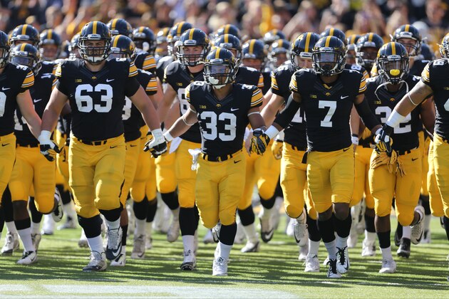 The Iowa Hawkeyes take the field before the start of an NCAA college football game against Illinois, Saturday, Oct. 10, 2015, in Iowa City, Iowa. (AP Photo/Justin Hayworth)