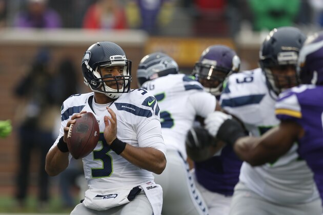 Seattle Seahawks quarterback Russell Wilson (3) looks to throw against the Minnesota Vikings in the first half of an NFL football game Sunday, Dec. 6, 2015 in Minneapolis. (AP Photo/Jim Mone)