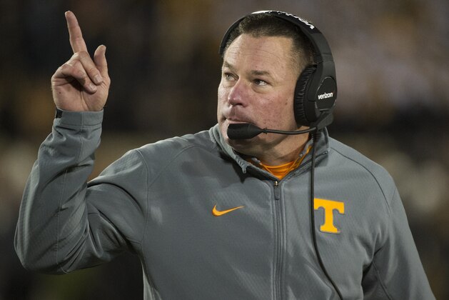 Tennessee head coach Butch Jones points to the scoreboard during the first quarter of an NCAA college football game against Missouri Saturday, Nov. 21, 2015, in Columbia, Mo. Tennessee won the game 19-8. (AP Photo/L.G. Patterson)
