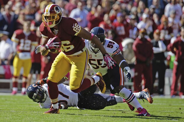 FILE - This Oct. 20, 2013 file photo shows Washington Redskins tight end Jordan Reed pulling away from Chicago Bears outside linebacker Lance Briggs (55) and inside linebacker Jon Bostic (57) during the first half of a NFL football game in Landover, Md. Reed is the latest example of the modern model for his position _ a 6-foot-2, 243-pound guy who will line up next to the offensive line, yes, and go across the middle, yes, but also can speed into space and is, as quarterback Robert Griffin III put it, FILE - This Oct. 20, 2013 file photo shows Washington Redskins tight end Jordan Reed pulling away from Chicago Bears outside linebacker Lance Briggs (55) and inside linebacker Jon Bostic (57) during the first half of a NFL football game in Landover, Md. Reed is the latest example of the modern model for his position _ a 6-foot-2, 243-pound guy who will line up next to the offensive line, yes, and go across the middle, yes, but also can speed into space and is, as quarterback Robert Griffin III put it,