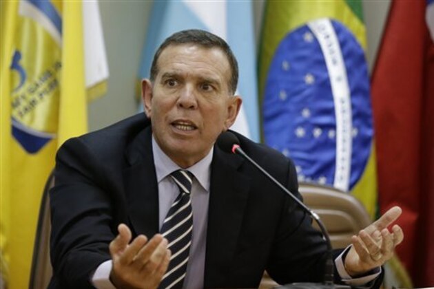FILE - In this May 21, 2015 file photo, CONMEBOL President Juan Angel Napout talks during a press conference in Asuncion, Paraguay. Napout was arrested on Thursday, Dec. 3, 2015, in a pre-dawn raid at a luxury hotel in Switzerland as part of the U.S. Department of Justice's widening bribery case that has shaken world soccer's scandal-hit governing body, FIFA. The Swiss justice ministry says, Napout who is also a FIFA vice president, is opposing his extradition to the U.S. (AP Photo/Jorge Saenz, File) FILE - In this May 21, 2015 file photo, CONMEBOL President Juan Angel Napout talks during a press conference in Asuncion, Paraguay. Napout was arrested on Thursday, Dec. 3, 2015, in a pre-dawn raid at a luxury hotel in Switzerland as part of the U.S. Department of Justice's widening bribery case that has shaken world soccer's scandal-hit governing body, FIFA. The Swiss justice ministry says, Napout who is also a FIFA vice president, is opposing his extradition to the U.S. (AP Photo/Jorge Saenz, File)