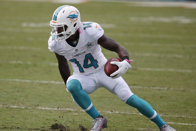 Miami Dolphins wide receiver Jarvis Landry (14) runs with the ball during the first half of an NFL football game against the Houston Texans, Sunday, Oct. 25, 2015 in Miami, Fla. (AP Photo/Wilfredo Lee)