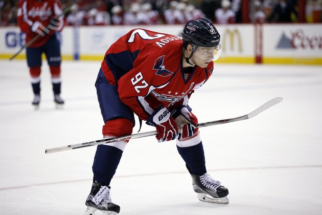 Washington Capitals center Evgeny Kuznetsov (92), from Russia, pauses on the ice in the second period of an NHL hockey game against the Detroit Red Wings, Tuesday, Dec. 8, 2015, in Washington. (AP Photo/Alex Brandon)
