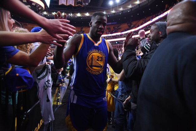 BOSTON, MA - DECEMBER 11:  Draymond Green #23 of the Golden State Warriors high fives fans after the game against the Boston Celtics on December 11, 2015 at the TD Garden in Boston, Massachusetts.  NOTE TO USER: User expressly acknowledges and agrees that, by downloading and or using this photograph, User is consenting to the terms and conditions of the Getty Images License Agreement. Mandatory Copyright Notice: Copyright 2015 NBAE  (Photo by Brian Babineau/NBAE via Getty Images)