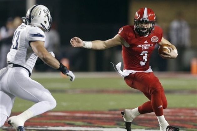 Jacksonville State cornerback Bryant Horn (29) looks for running room around Charleston Southern linebacker Zane Cruz (43) during the first half of an NCAA college football game, Friday, Dec. 11, 2015, in Jacksonville, Ala. (AP Photo/ Butch Dill)