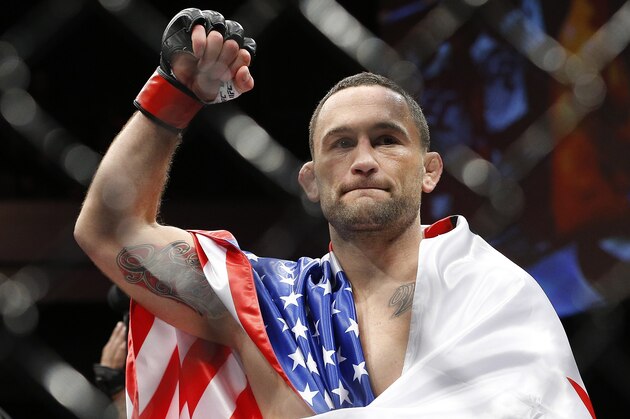 Frankie Edgar celebrates after defeating Chad Mendes in a featherweight bout during The Ultimate Fighter finale Friday, Dec. 11, 2015, in Las Vegas. (AP Photo/John Locher)