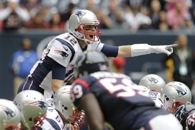 FILE - In this Dec. 1, 2013, file photo, New England Patriots' Tom Brady calls signals against the Houston Texans during the first quarter of an NFL football game in Houston. The no-huddle offense has been a part of pro football since John Unitas pretty much invented the two-minute drill. It normally was reserved for late portions of halves and games. It’s running rampant through the league now, its popularity buoyed by the record-smashing seasons Peyton Manning and Brady recently put together. (AP Photo/Patric Schneider, File)