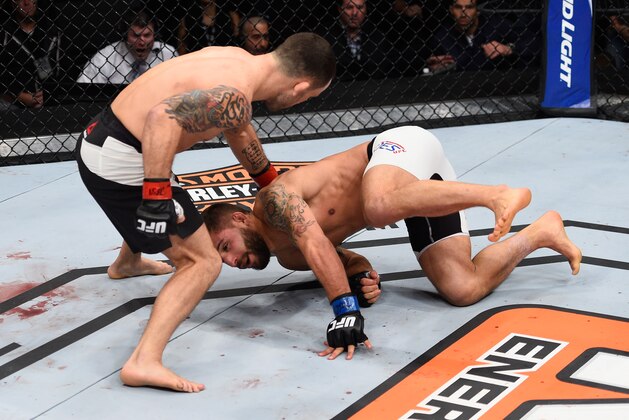 LAS VEGAS, NV - DECEMBER 11: (L-R) Frankie Edgar punches Chad Mendes in their featherweight bout during the TUF Finale event inside The Chelsea at The Cosmopolitan of Las Vegas on December 11, 2015 in Las Vegas, Nevada.  (Photo by Jeff Bottari/Zuffa LLC/Zuffa LLC via Getty Images)