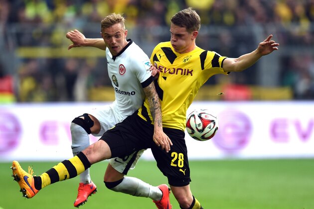Frankfurt's midfielder Sonny Kittel (L) and Dortmund's defender Matthias Ginter vie for the ball  during the German first division Bundesliga football match between BVB Borussia Dortmund v Eintracht Frankfurt in Dortmund, Germany, on April 25, 2015. AFP PHOTO / PATRIK STOLLARZ

RESTRICTIONS - DFL RULES TO LIMIT THE ONLINE USAGE DURING MATCH TIME TO 15 PICTURES PER MATCH. IMAGE SEQUENCES TO SIMULATE VIDEO IS NOT ALLOWED AT ANY TIME. FOR FURTHER QUERIES PLEASE CONTACT DFL DIRECTLY AT + 49 69 650050.        (Photo credit should read PATRIK STOLLARZ/AFP/Getty Images)