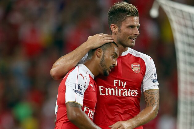 SINGAPORE - JULY 18:  Theo Walcott of Arsenal celebrates with Olivier Giroud after scoring the 1st goal against Everton during the Barclays Asia Trophy final match between Arsenal and Everton at the National Stadium on July 18, 2015 in Singapore.  (Photo by Stanley Chou/Getty Images)