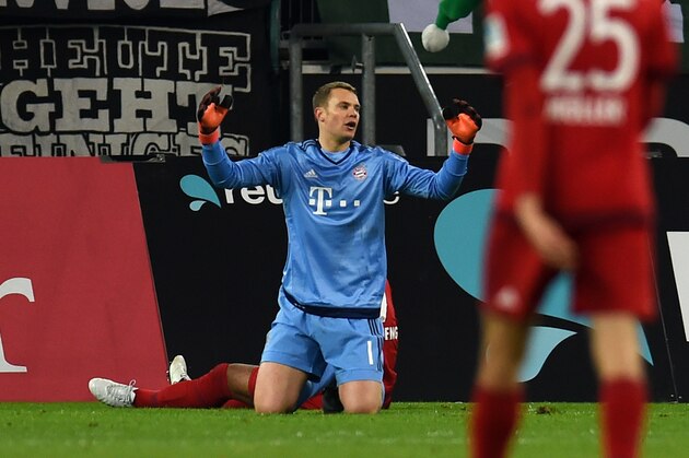 Bayern Munich's goalkeeper Manuel Neuer reacts during the German first division Bundesliga football match Moenchengladbach vs Bayern Munich in Moenchengladbach on December 5, 2015.  
AFP PHOTO / PATRIK STOLLARZ
RESTRICTIONS: DURING MATCH TIME: DFL RULES TO LIMIT THE ONLINE USAGE TO 15 PICTURES PER MATCH AND FORBID IMAGE SEQUENCES TO SIMULATE VIDEO. == RESTRICTED TO EDITORIAL USE == FOR FURTHER QUERIES PLEASE CONTACT DFL DIRECTLY AT + 49 69 650050. / AFP / PATRIK STOLLARZ        (Photo credit should read PATRIK STOLLARZ/AFP/Getty Images)