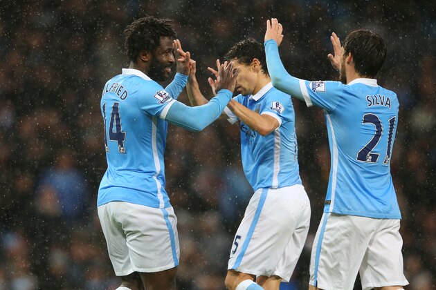 MANCHESTER, ENGLAND - DECEMBER 12:  Wilfred Bony (L) of Manchester City celebrates scoring his team's first goal with his team mates Jesus Navas (C) and David Silva (R) during the Barclays Premier League match between Manchester City and Swansea City at Etihad Stadium on December 12, 2015 in Manchester, United Kingdom.  (Photo by Alex Livesey/Getty Images)