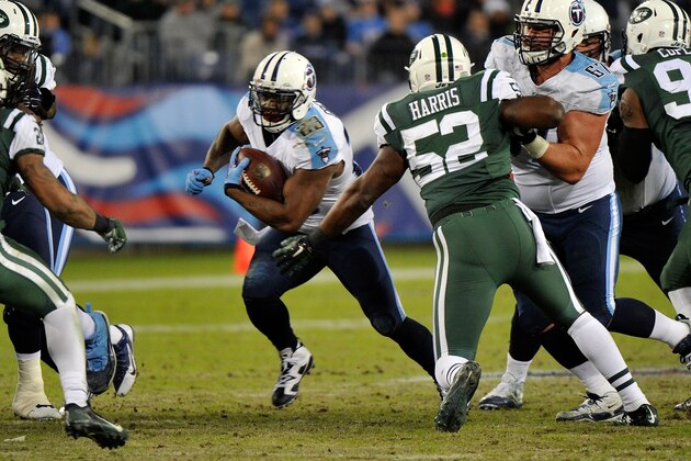NASHVILLE, TN - DECEMBER 14: Shonn Greene #23 of the Tennessee Titans rushes against David Harris #52 of the New York Jets during the second half of a game at LP Field on December 14, 2014 in Nashville, Tennessee.  (Photo by Frederick Breedon/Getty Images)