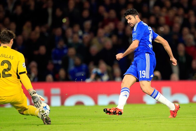 Porto goalkeeper Iker Casillas, left, blocks a shot from Chelsea's Diego Costa, right, during the Champions League group G soccer match between Chelsea and FC Porto at Stamford Bridge stadium in London, Wednesday, Dec. 9, 2015.(AP Photo/Alastair Grant)