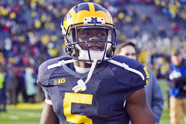 Michigan defensive back Jabrill Peppers (5) walk off the field after an NCAA college football game against Ohio State in Ann Arbor, Mich., Saturday, Nov. 28, 2015. Ohio State won 42-13. (AP Photo/Tony Ding)