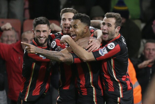 Bournemouth’s Joshua King, centre, celebrates after scoring a goal during the English Premier League soccer match between Bournemouth and Manchester United at the Vitality Stadium in Bournemouth, England, Saturday Dec. 12, 2015. (AP Photo/Tim Ireland)