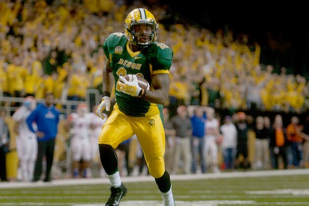 North Dakota State's John Crockett is alone during a long run early in the second half for a touchdown against Sam Houston State in the semifinals of the NCAA Football Championship Subdivision, Friday, Dec. 19, 2014, in Fargo, N.D. (AP Photo/Bruce Crummy)