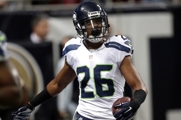 Seattle Seahawks defensive back Cary Williams after causing a fumble and running it back for a touchdown during the fourth quarter of an NFL football game against the St. Louis Rams Sunday, Sept. 13, 2015, in St. Louis. (AP Photo/Tom Gannam)