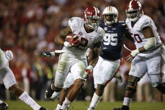 Alabama running back Derrick Henry (2) runs the ball and scores a touchdown during the second half of an NCAA college football game, Saturday, Nov. 28, 2015, in Auburn, Ala. Alabama won 29-13. (AP Photo/Gerald Herbert)