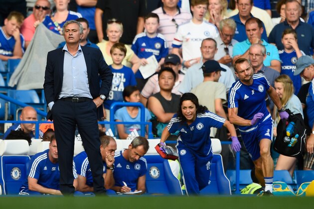 LONDON, ENGLAND - AUGUST 08:  Chelsea manager Jose Mourinho looks on as team doctor Eva Carneiro rushes to treat Eden Hazard during the Barclays Premier League match between Chelsea and Swansea City at Stamford Bridge on August 8, 2015 in London, England.(Photo by Mike Hewitt/Getty Images)