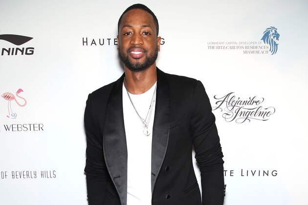 Dwyane Wade arrives during the Li-Ning & Alejandro Ingelmo shoe design unveiling at the Ritz-Carlton Residences, Miami Beach on Tuesday, Dec. 2, 2014 in Miami Beach, Fla. (Photo by Omar Vega/Invision/AP)