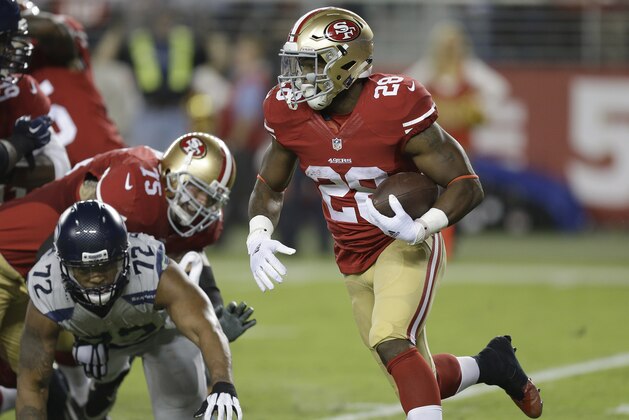 San Francisco 49ers running back Carlos Hyde (28) runs against the Seattle Seahawks during the second half of an NFL football game in Santa Clara, Calif., Thursday, Oct. 22, 2015. (AP Photo/Ben Margot)