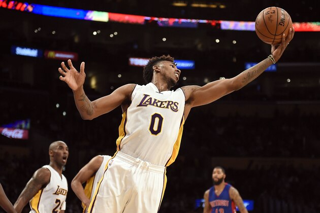 Nov 15, 2015; Los Angeles, CA, USA; Los Angeles Lakers forward Nick Young (0) grabs a rebound during the fourth quarter against the Detroit Pistons at Staples Center. Mandatory Credit: Richard Mackson-USA TODAY Sports