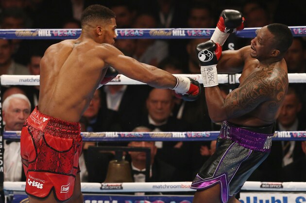 British boxer Anthony Joshua (L) vies against British boxer Dillian Whyte during their British and Commonwealth heavyweight title boxing match at the O2 arena in London on December 12, 2015. AFP PHOTO / JUSTIN TALLIS / AFP / JUSTIN TALLIS        (Photo credit should read JUSTIN TALLIS/AFP/Getty Images)