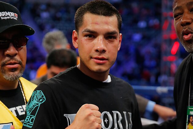 LOS ANGELES, CA - APRIL 26:  Omar Figueroa Jr. celebrates his decision win over Jerry Belmontes during their WBC Lightweight World Championship title bout at StubHub Center on April 26, 2014 in Los Angeles, California.  (Photo by Joe Scarnici/Getty Images)