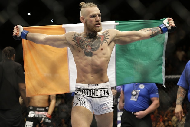 Connor McGregor celebrates after defeating Dustin Poirier in their featherweight mixed martial arts bout at UFC 178 on Saturday, Sept. 27, 2014, in Las Vegas. (AP Photo/John Locher)